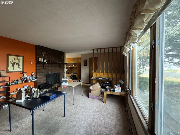 a living room with fireplace furniture and a fireplace