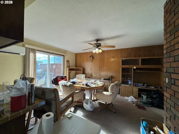 a view of a livingroom with furniture and a window