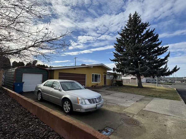 a dining room with a sink and a mirror
