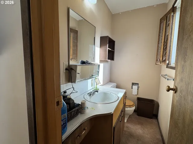 a work room with furniture and a window