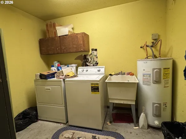 a view of a bathroom with a tub and shower