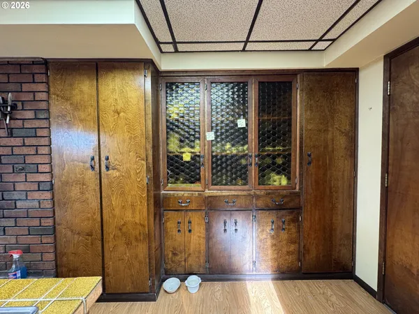 a kitchen that has a sink stainless steel appliances a counter space and a window