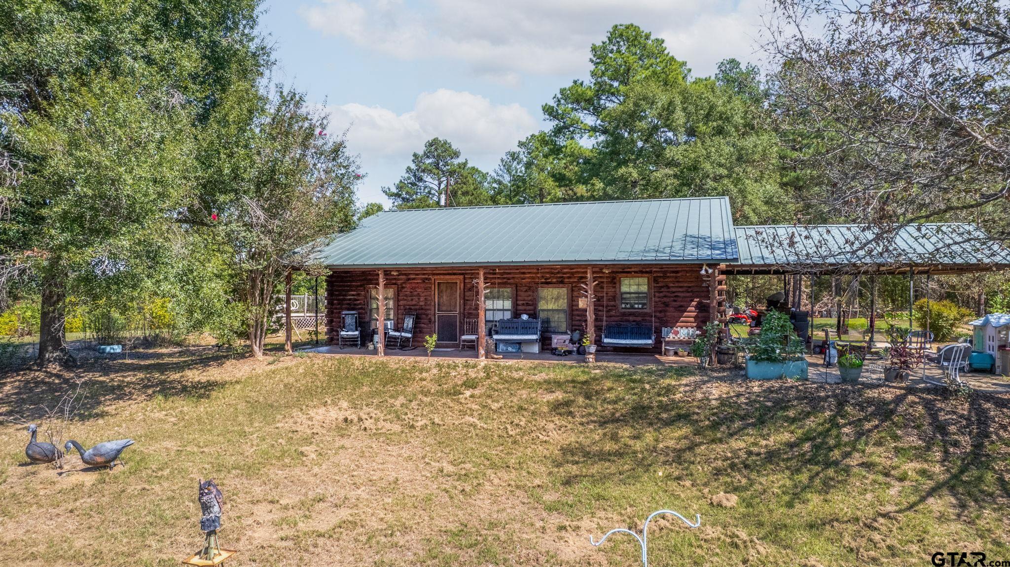 a view of a house with a patio and a slide