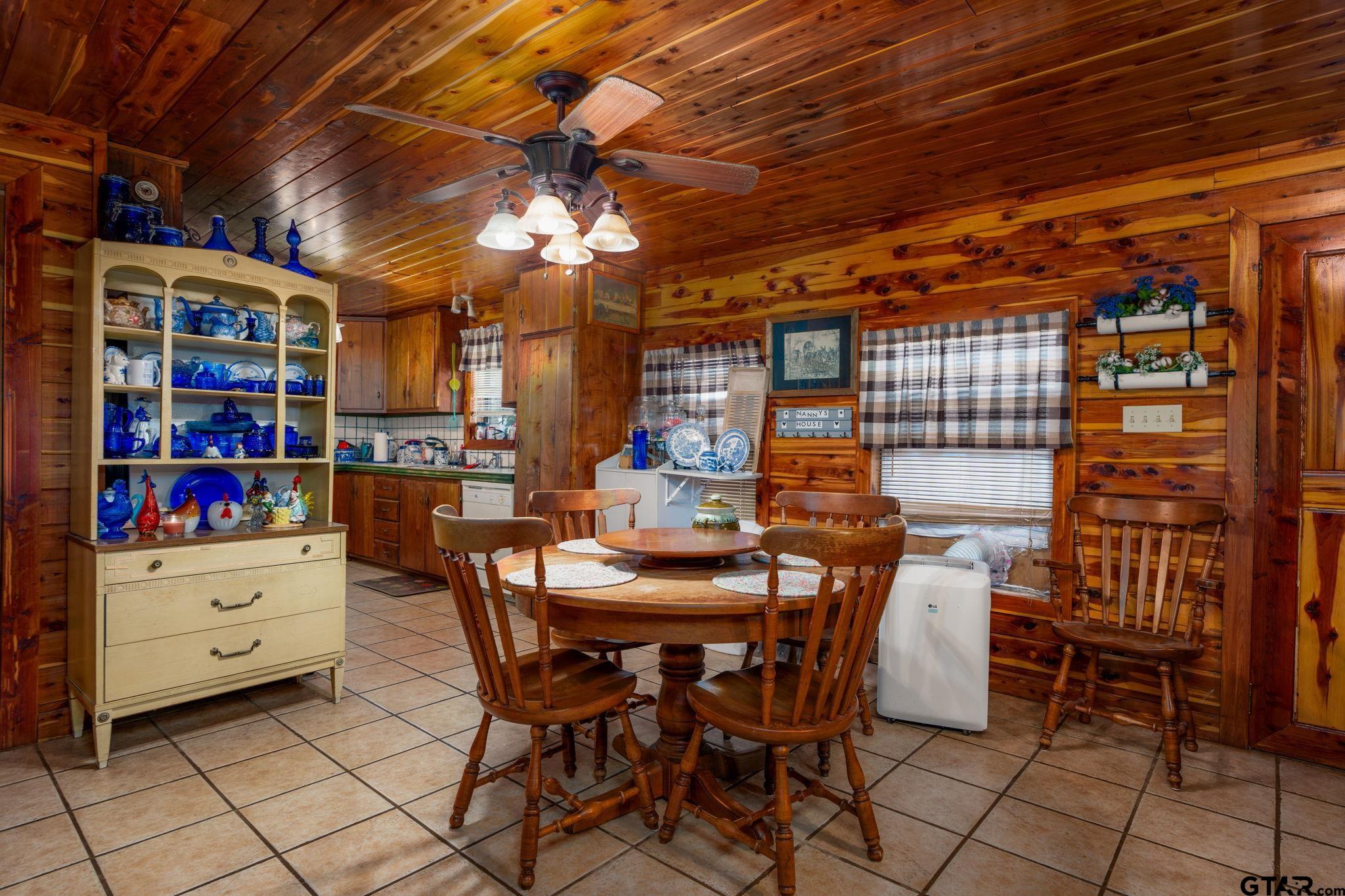 18596 County Road 2154 Troup, TX 75789 - Photo 5 of 21 a view of a dining room with furniture and chandelier