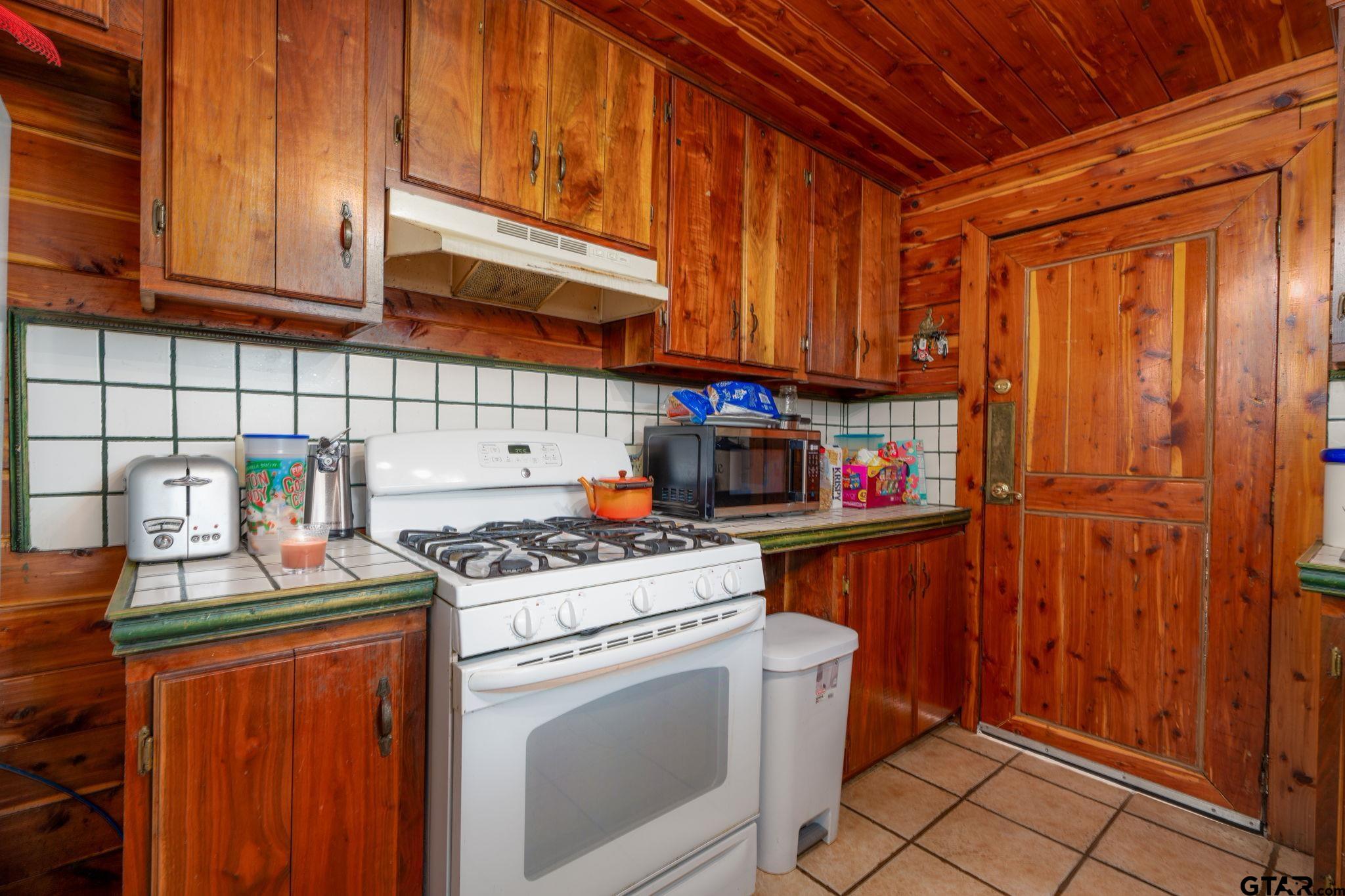 18596 County Road 2154 Troup, TX 75789 - Photo 7 of 21 a kitchen with stainless steel appliances granite countertop a stove and a refrigerator