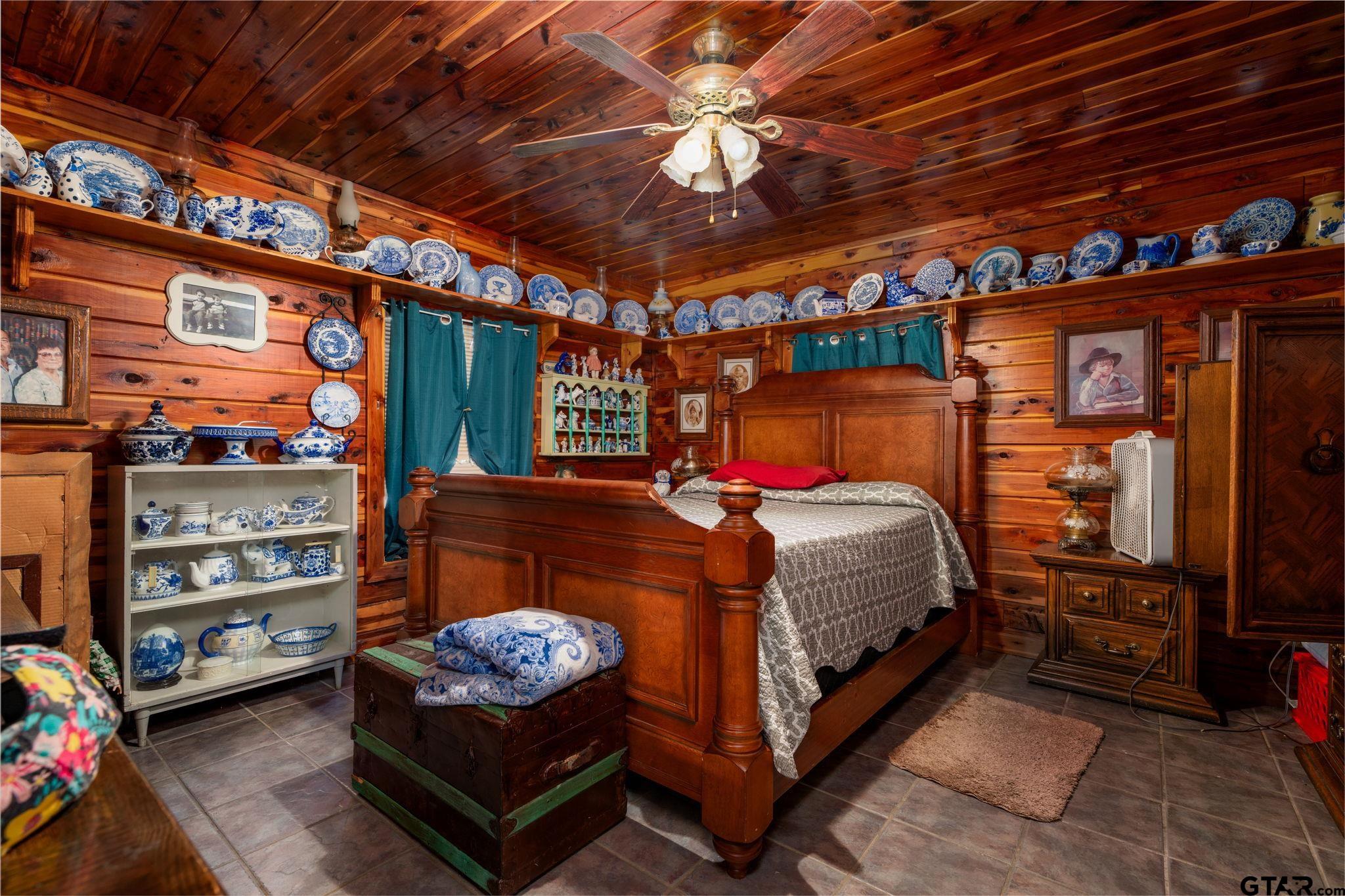 18596 County Road 2154 Troup, TX 75789 - Photo 9 of 21 a bed room with a bed and a chair