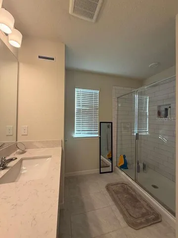 a bedroom with a bed and a cabinets