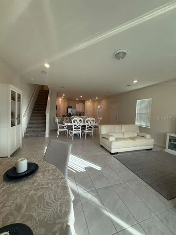 a living room with furniture and a table