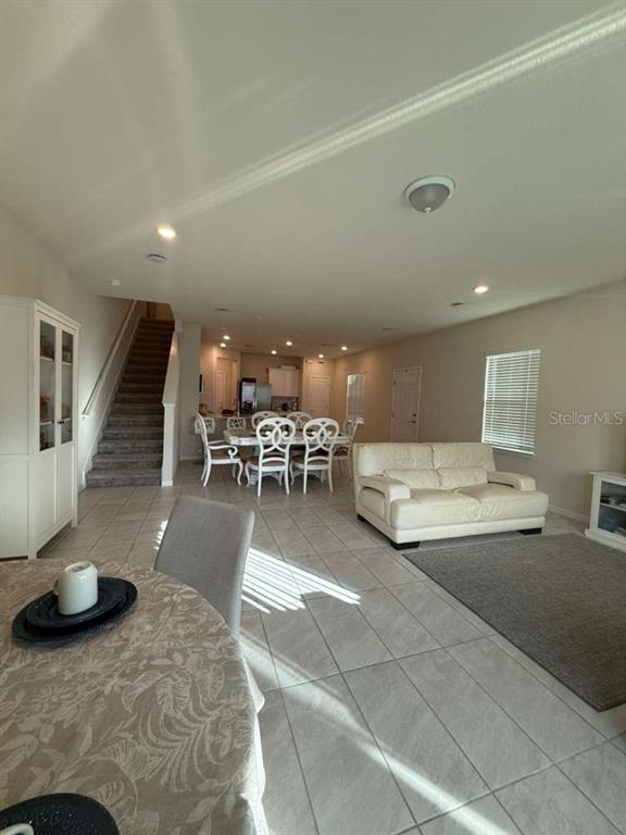 2579 Winsome Way Davenport, FL 33896 - Photo 2 of 25 a living room with furniture and a table