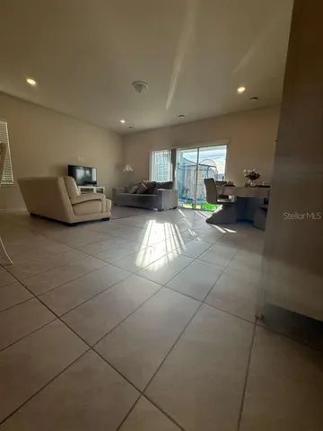 a living room with furniture and a table