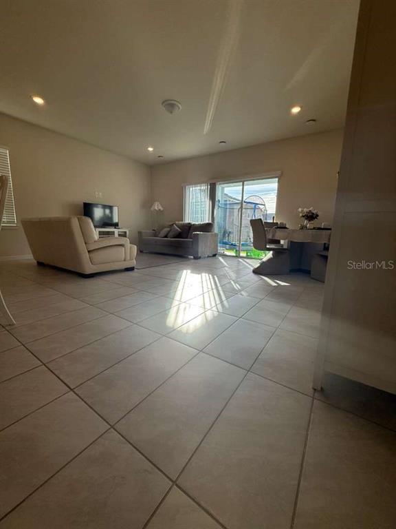 2579 Winsome Way Davenport, FL 33896 - Photo 8 of 25 a living room with furniture and a table