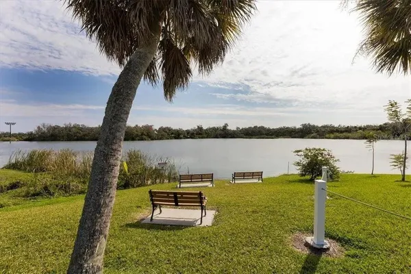 a view of a lake with a garden