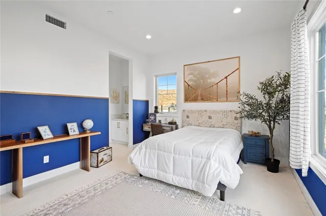 a bedroom with a bed and a table