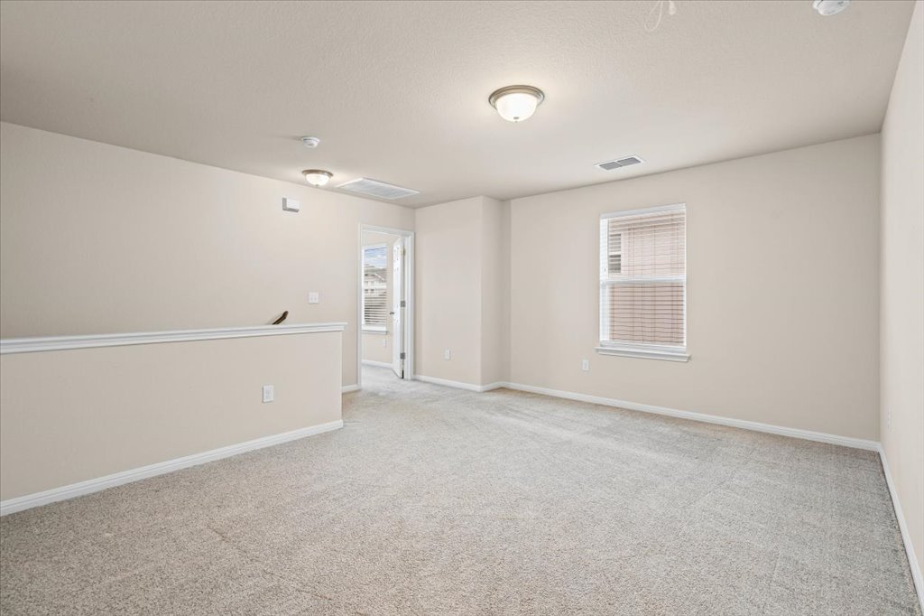 6313 Mary Lewis Drive Austin, TX 78747 - Photo 9 of 20 an empty room with windows