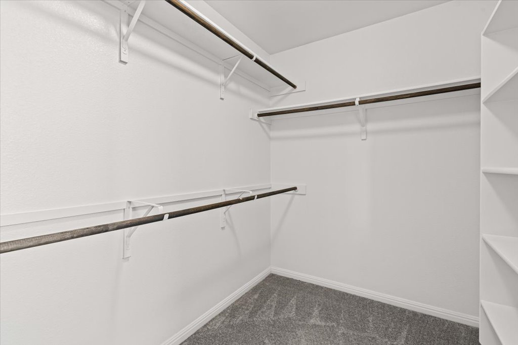 6313 Mary Lewis Drive Austin, TX 78747 - Photo 12 of 20 a view of a room with racks on the wall