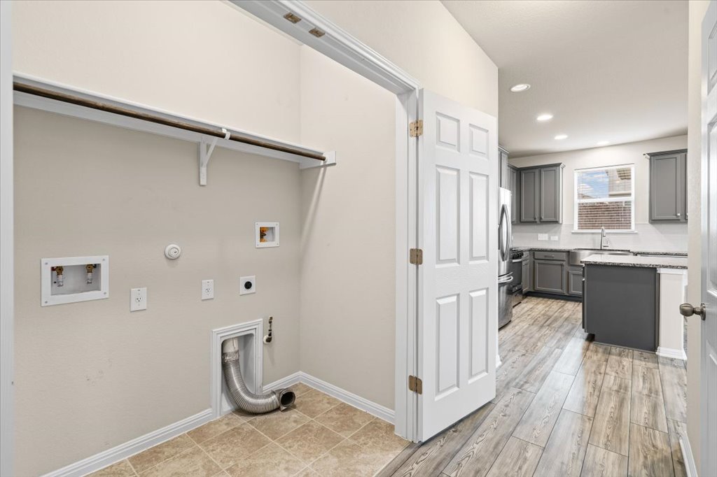 6313 Mary Lewis Drive Austin, TX 78747 - Photo 16 of 20 a bathroom with a sink a toilet and shower