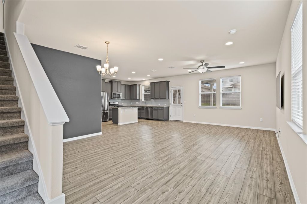 6313 Mary Lewis Drive Austin, TX 78747 - Photo 19 of 20 a view of a kitchen with furniture and wooden floor