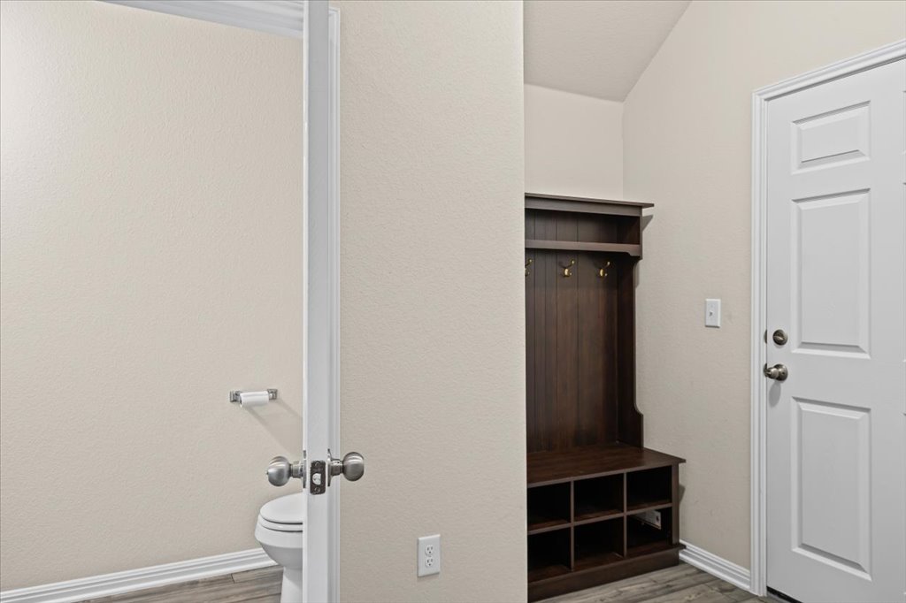 6313 Mary Lewis Drive Austin, TX 78747 - Photo 6 of 20 a bathroom with a toilet and a shower