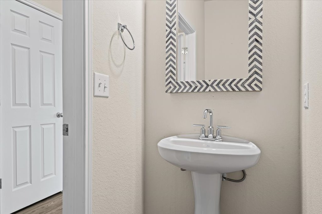 6313 Mary Lewis Drive Austin, TX 78747 - Photo 7 of 20 a bathroom with a sink and mirror