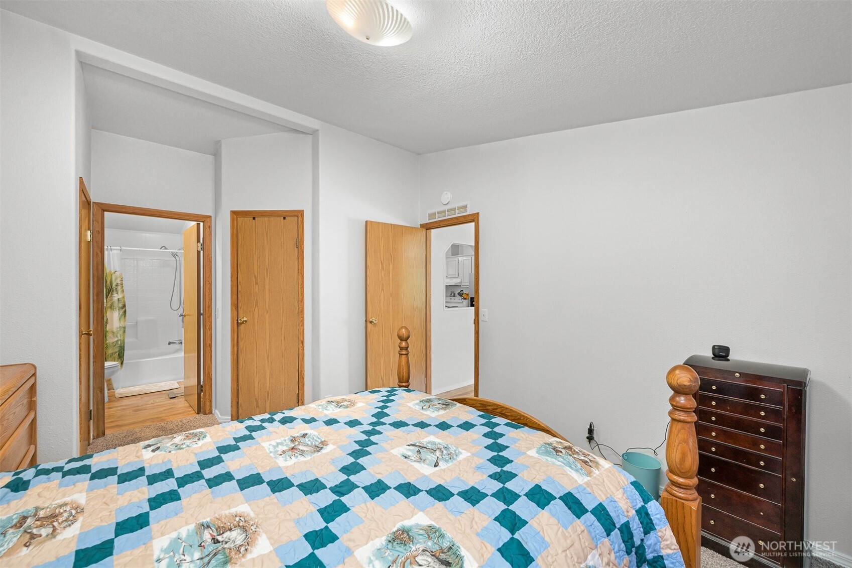 2174 Yew Street Road, Unit 22 Bellingham, WA 98229 - Photo 25 of 36 a bedroom with a bed and a dresser