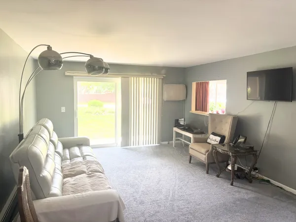 a bedroom with a bed and a chair