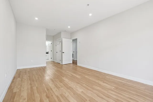 a view of walk in closet with empty racks