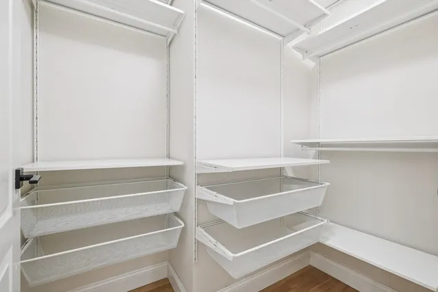 a workspace with furniture and a book shelf