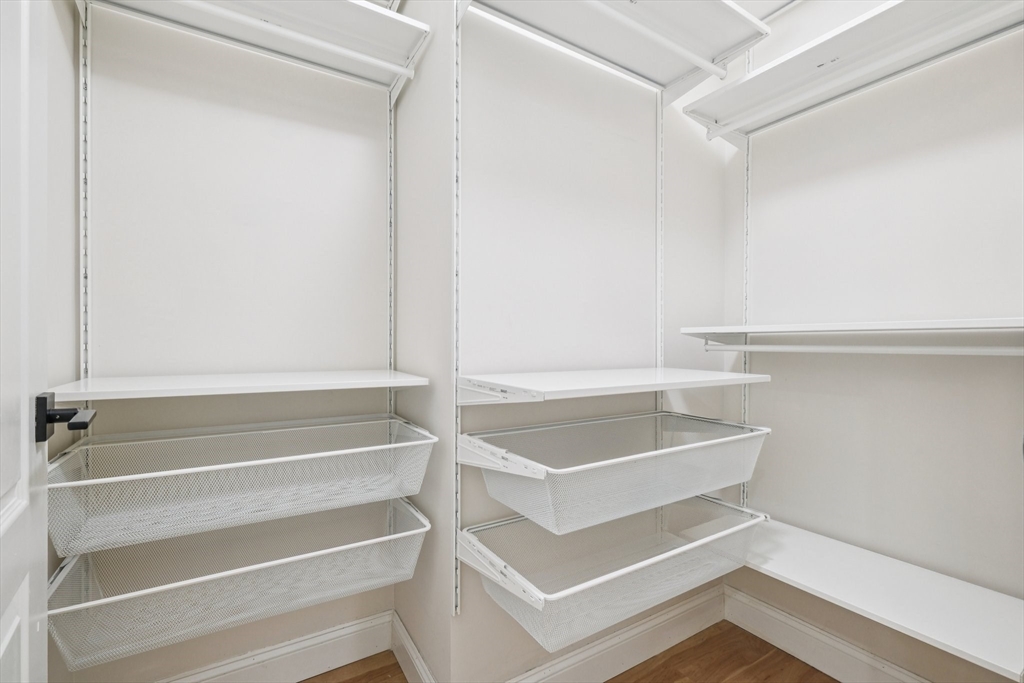 614 Pond Street, Unit 2104 Braintree, MA 02184 - Photo 12 of 29 a view of walk in closet with empty racks