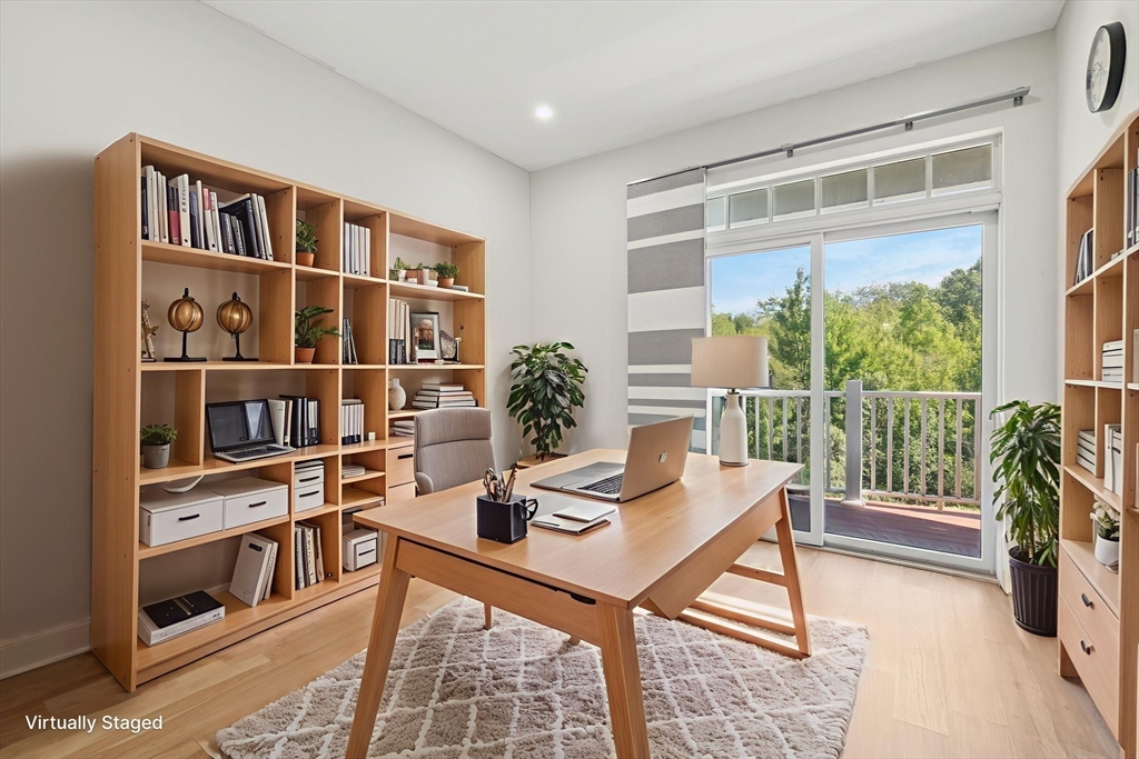 614 Pond Street, Unit 2104 Braintree, MA 02184 - Photo 13 of 29 a workspace with furniture and a book shelf