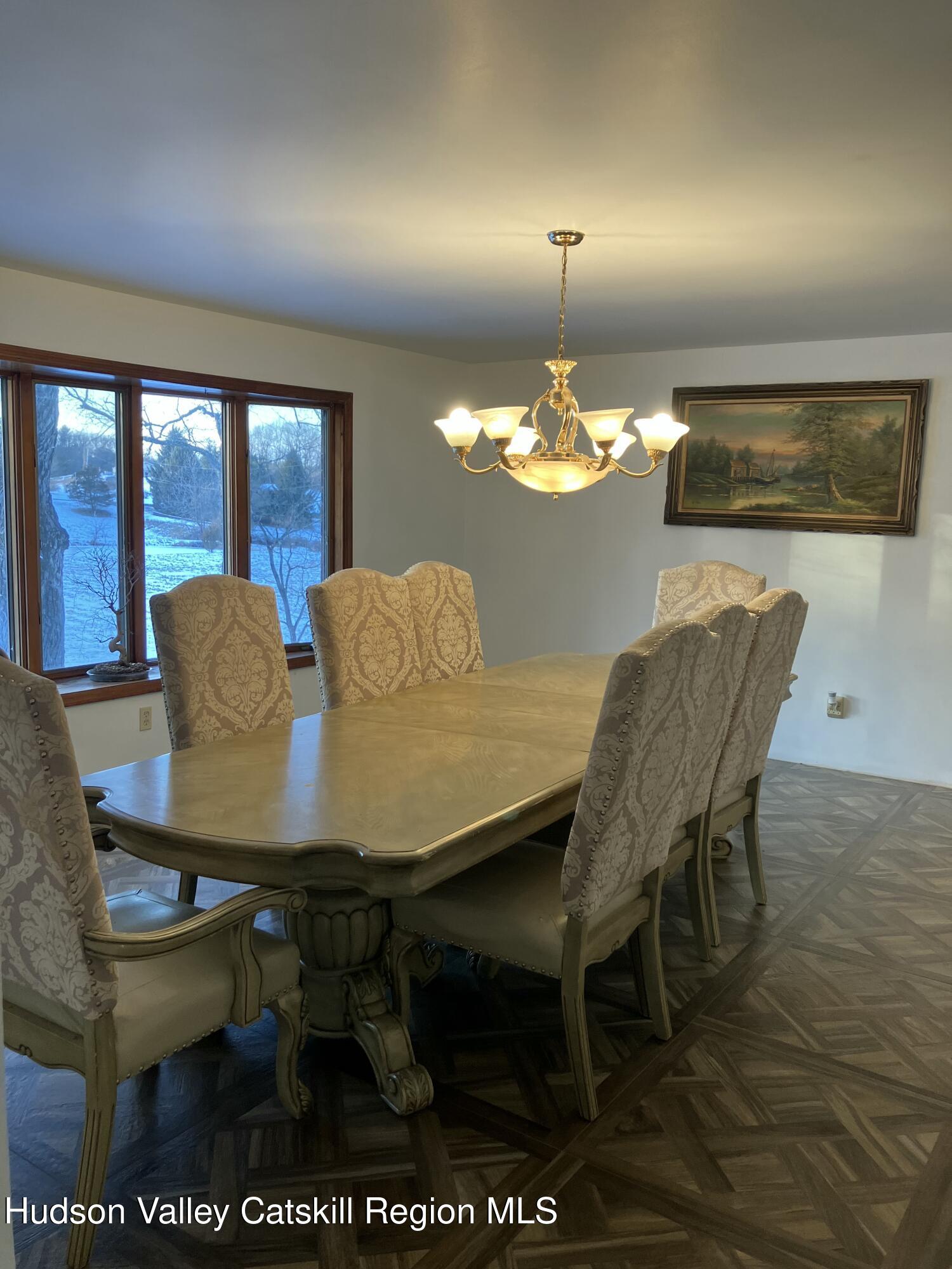 38 Bethel Ridge Road Catskill, NY 12414 - Photo 20 of 52 a view of a dining room with furniture and chandelier