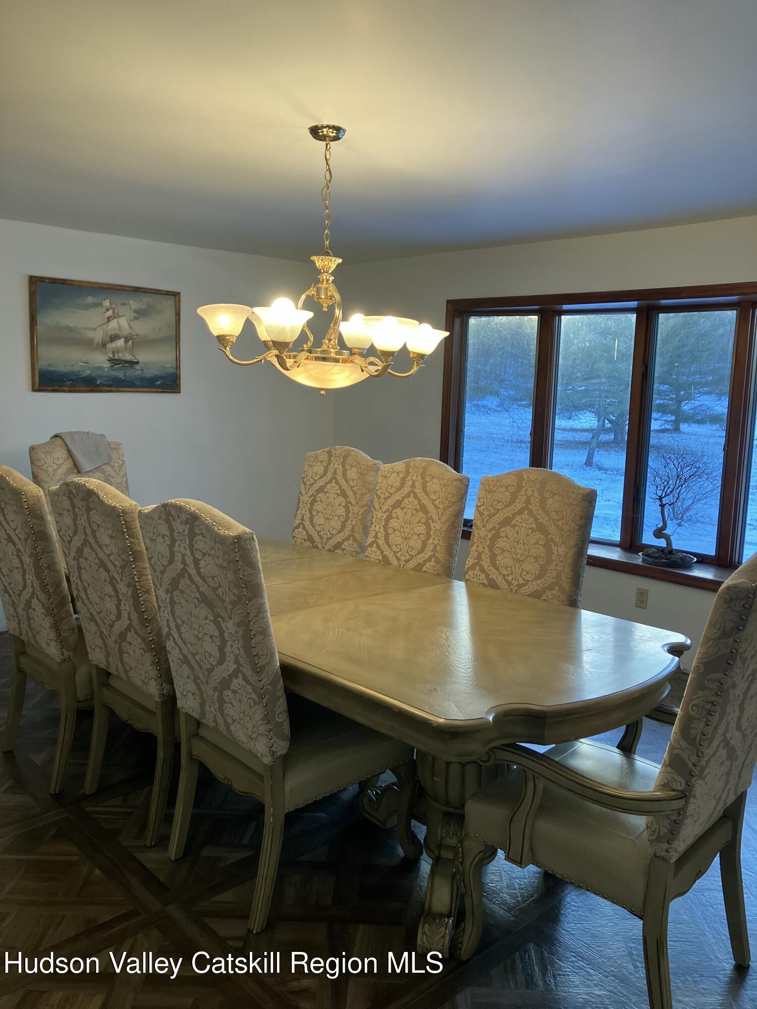 38 Bethel Ridge Road Catskill, NY 12414 - Photo 21 of 52 a view of a dining room with furniture and wooden floor