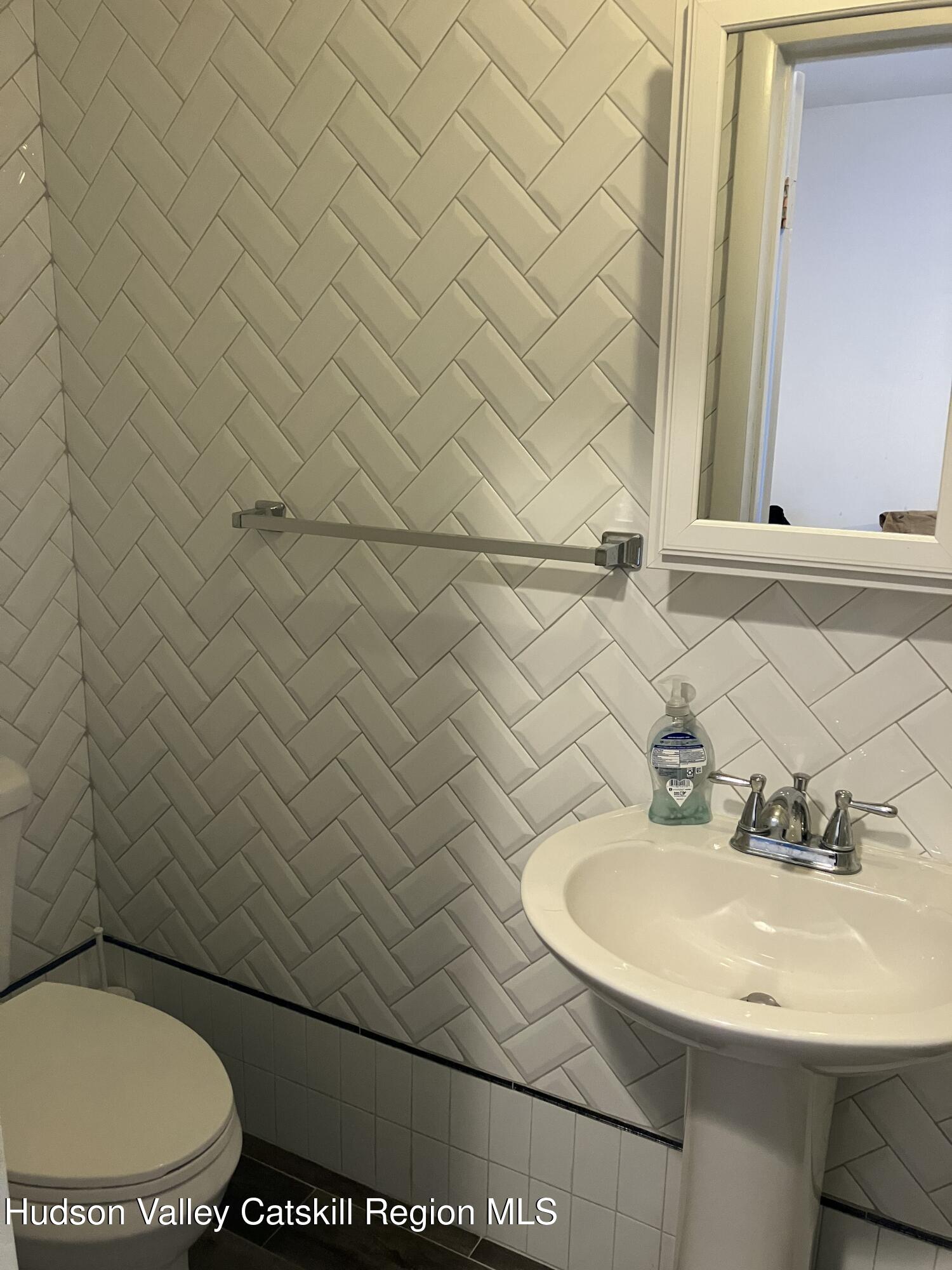38 Bethel Ridge Road Catskill, NY 12414 - Photo 29 of 52 a bathroom with a sink and a toilet