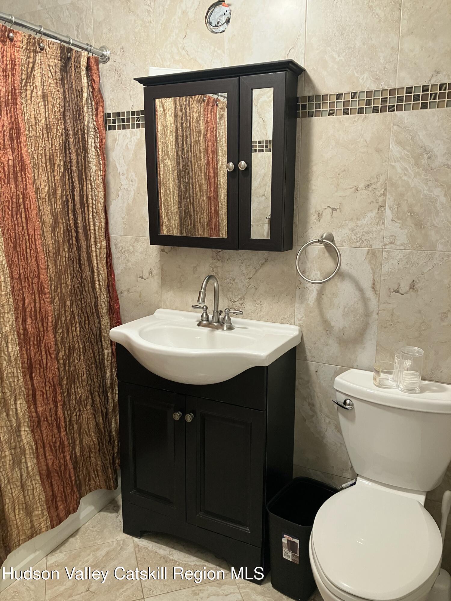 38 Bethel Ridge Road Catskill, NY 12414 - Photo 36 of 52 a bathroom with a sink toilet and shower
