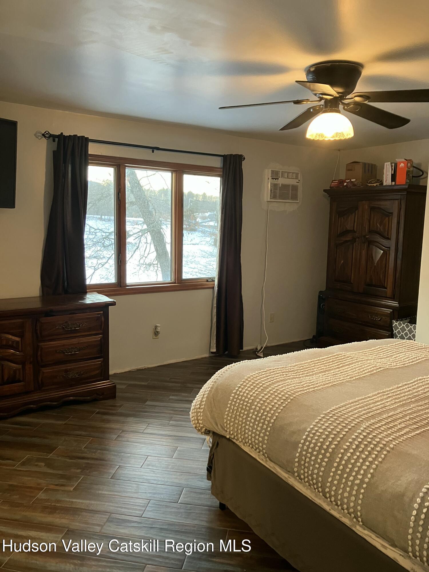 38 Bethel Ridge Road Catskill, NY 12414 - Photo 41 of 52 a bedroom with a bed and a window