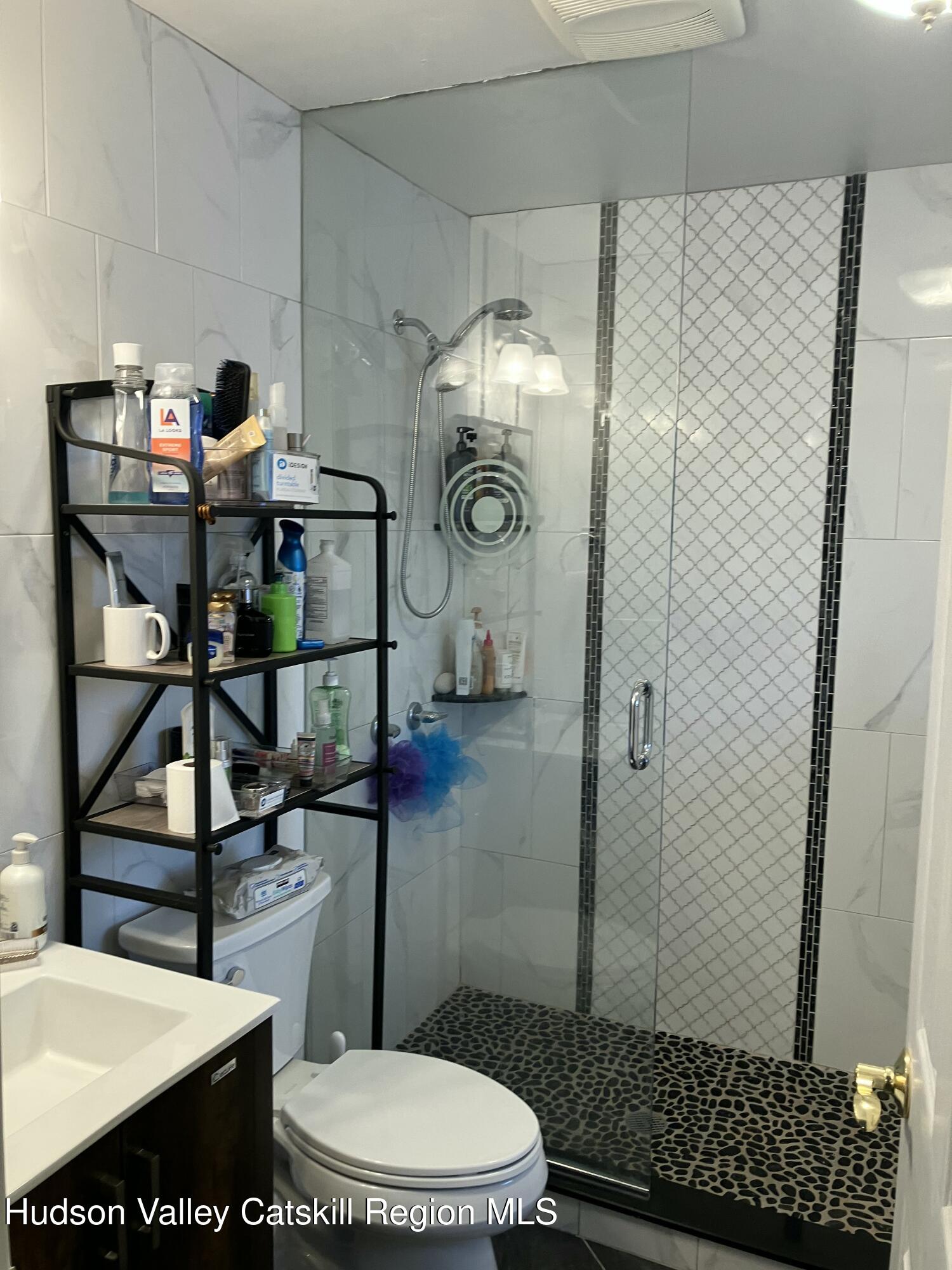 38 Bethel Ridge Road Catskill, NY 12414 - Photo 42 of 52 a bathroom with a toilet and a shower