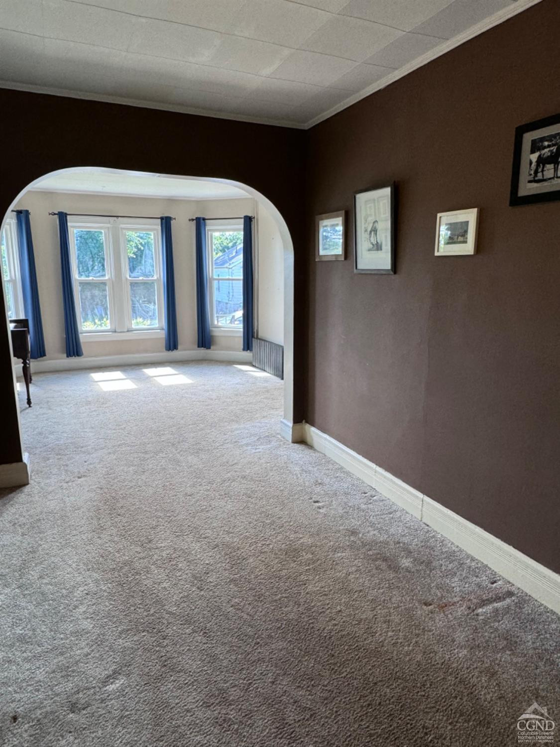 95 Maple Avenue Catskill, NY 12414 - Photo 11 of 25 a view of a big room with windows and chandelier