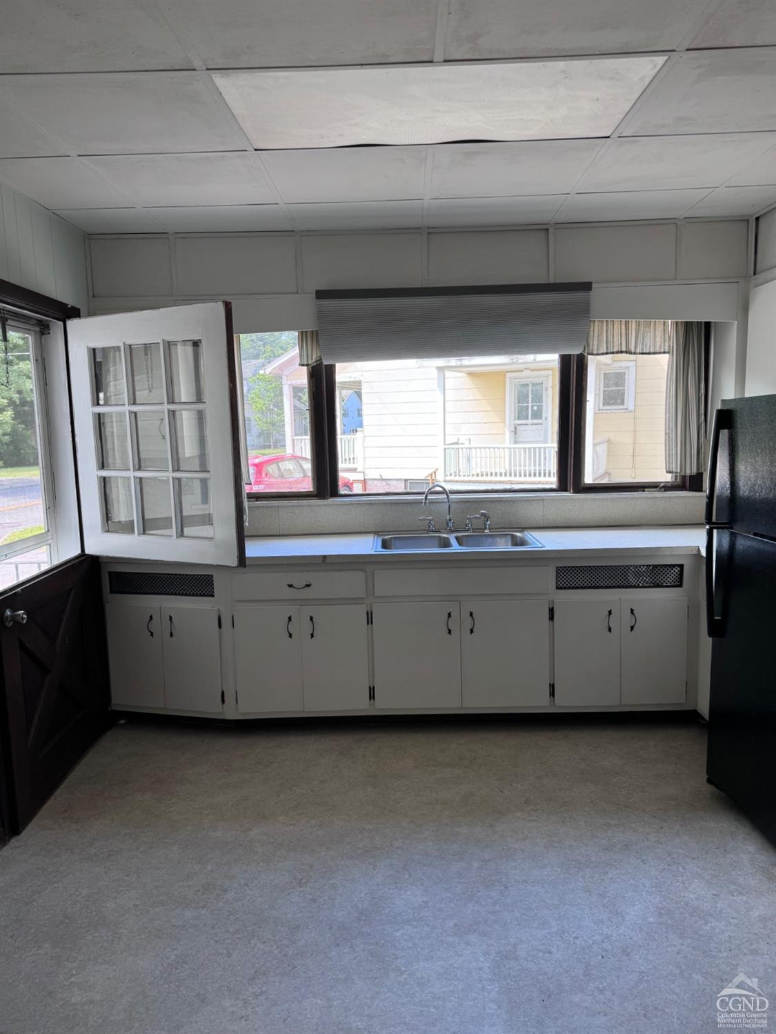 95 Maple Avenue Catskill, NY 12414 - Photo 12 of 25 a kitchen with granite countertop white cabinets and a sink