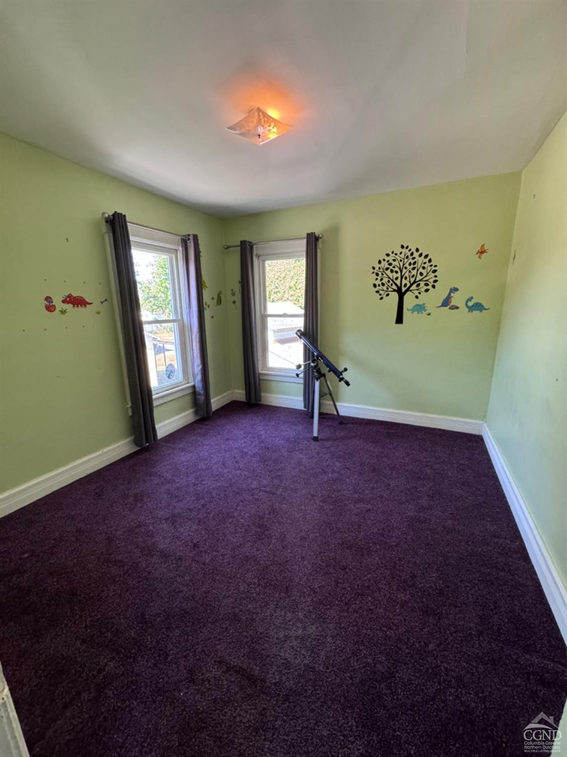95 Maple Avenue Catskill, NY 12414 - Photo 16 of 25 a view of livingroom with window and hardwood floor