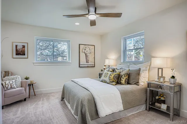 a bedroom with a bed and a couch