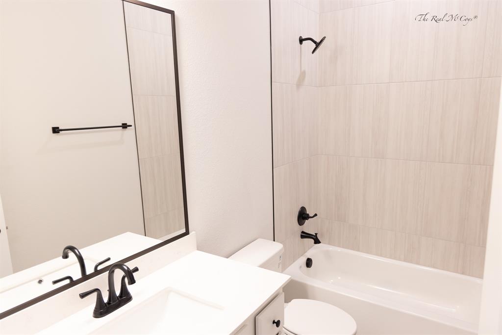 4328 Corn Husk Drive Frisco, TX 75033 - Photo 17 of 22 a bathroom with a sink and a mirror