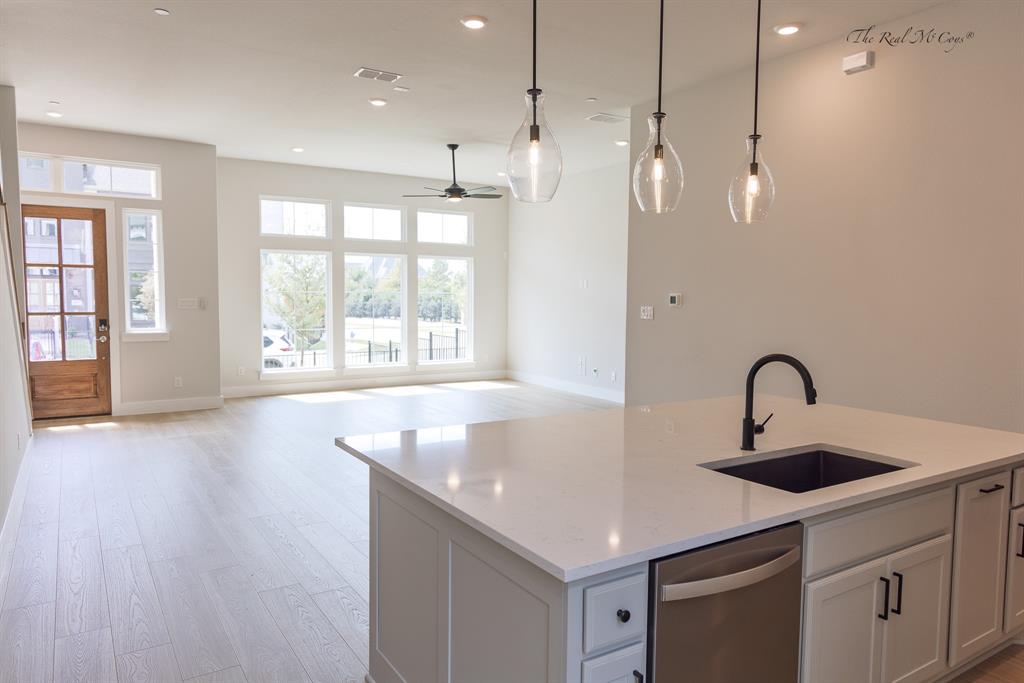 4328 Corn Husk Drive Frisco, TX 75033 - Photo 3 of 22 a kitchen with stainless steel appliances granite countertop a sink a window and a counter space