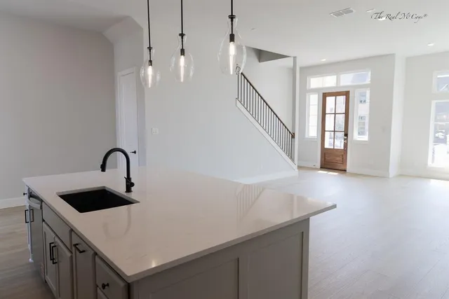a view of a kitchen cabinets a sink and dishwasher in a kitchen