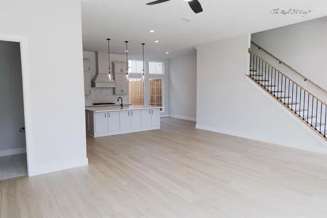 a view of a kitchen with wooden floor