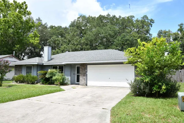 front view of a house with a yard