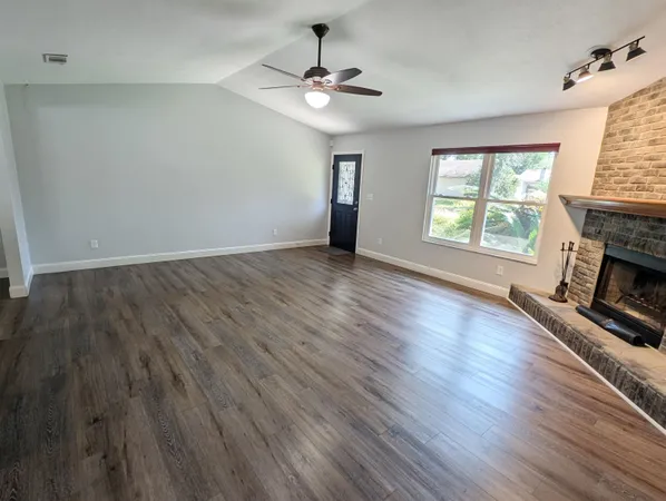 a kitchen with granite countertop a stove and a microwave