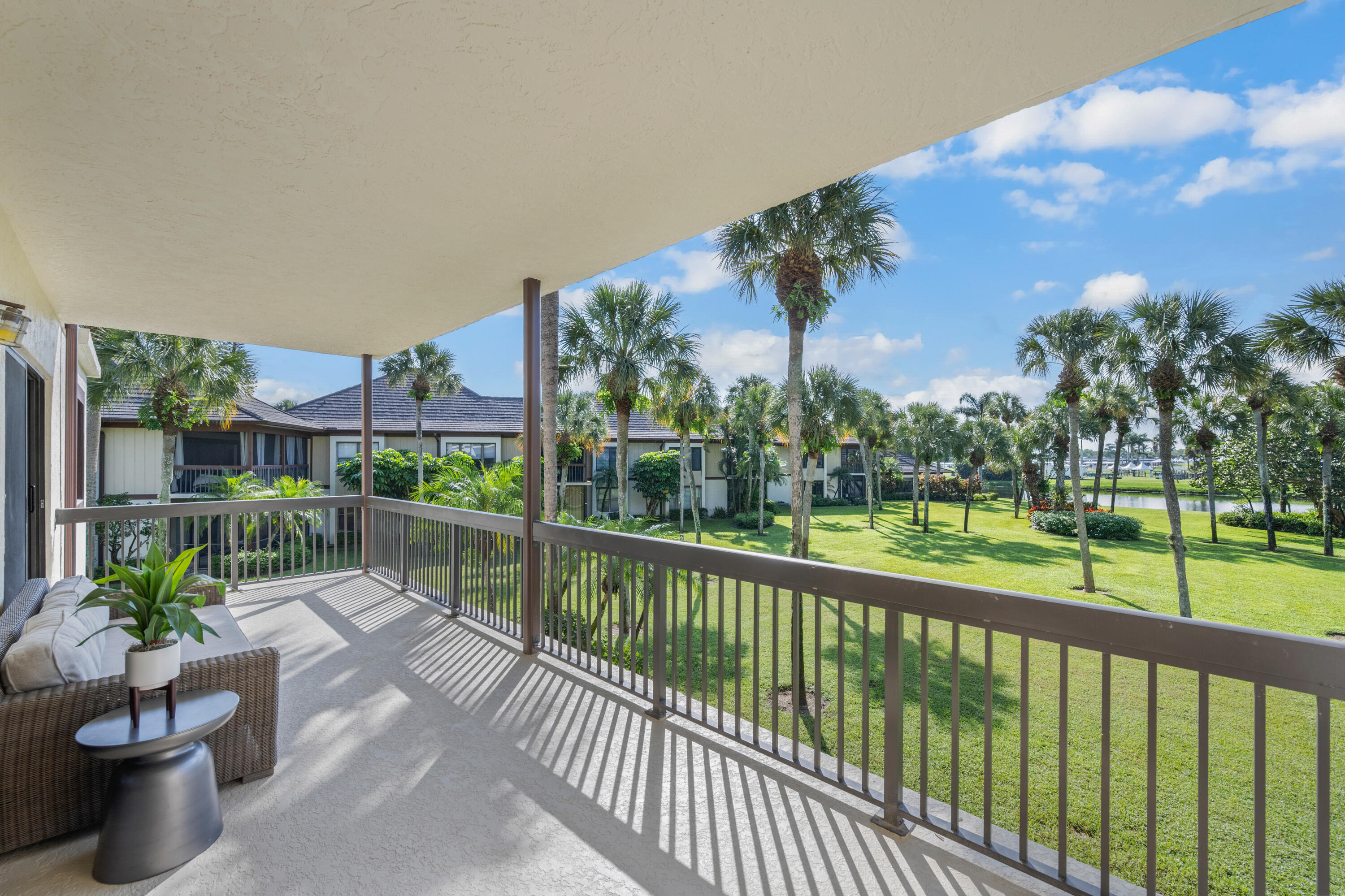 13388 Polo Road West, Unit 201 Wellington, FL 33414 - Photo 12 of 19 a view of a porch with a potted plant