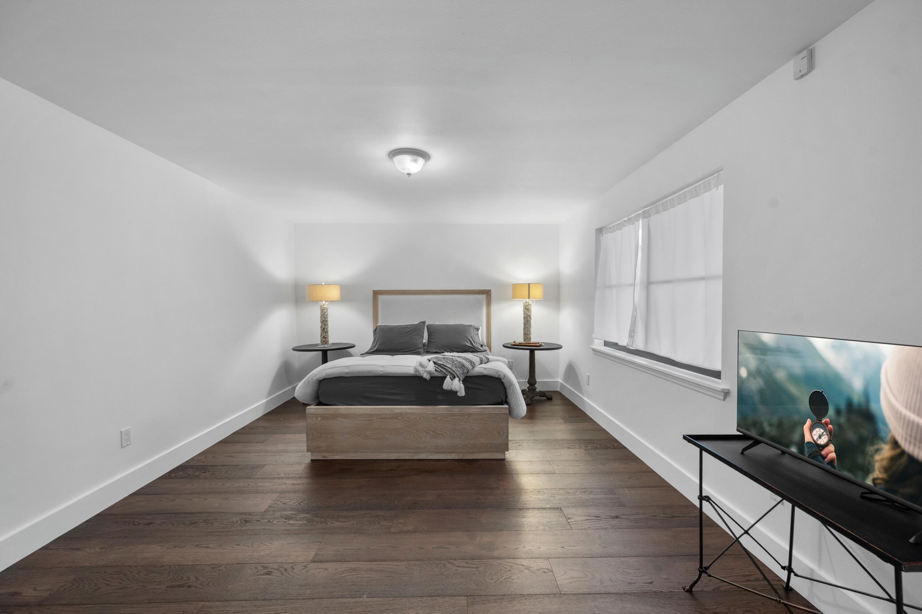 13388 Polo Road West, Unit 201 Wellington, FL 33414 - Photo 13 of 19 a bedroom with a bed and a potted plant on the dresser