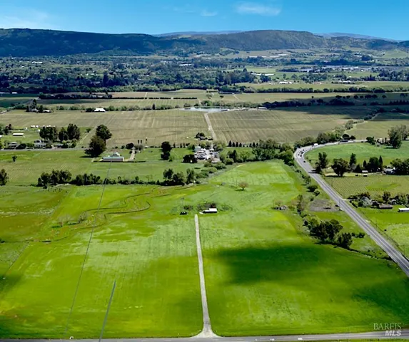 a view of a lake with a yard
