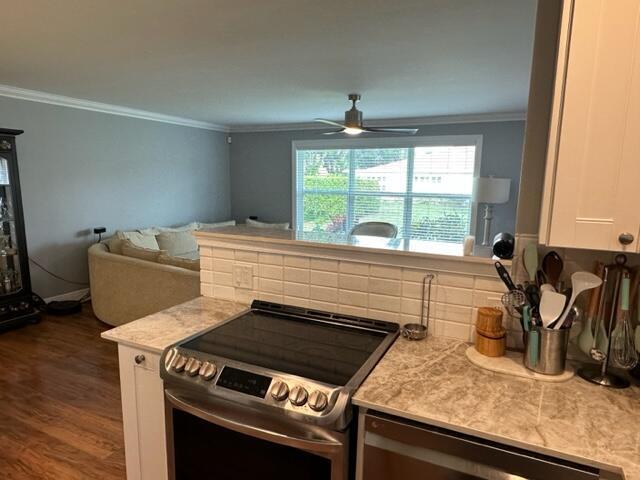 4585 Northwest 3rd Street, Unit D Delray Beach, FL 33445 - Photo 11 of 42 a kitchen with granite countertop a stove and a sink