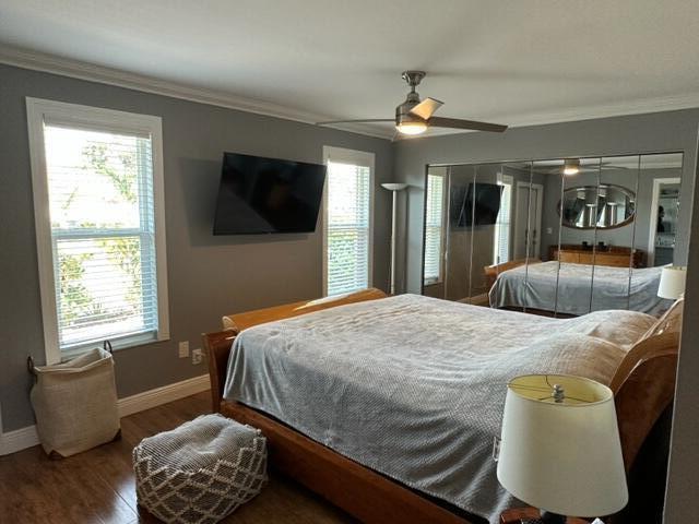 4585 Northwest 3rd Street, Unit D Delray Beach, FL 33445 - Photo 28 of 42 a bedroom with a bed window and couch
